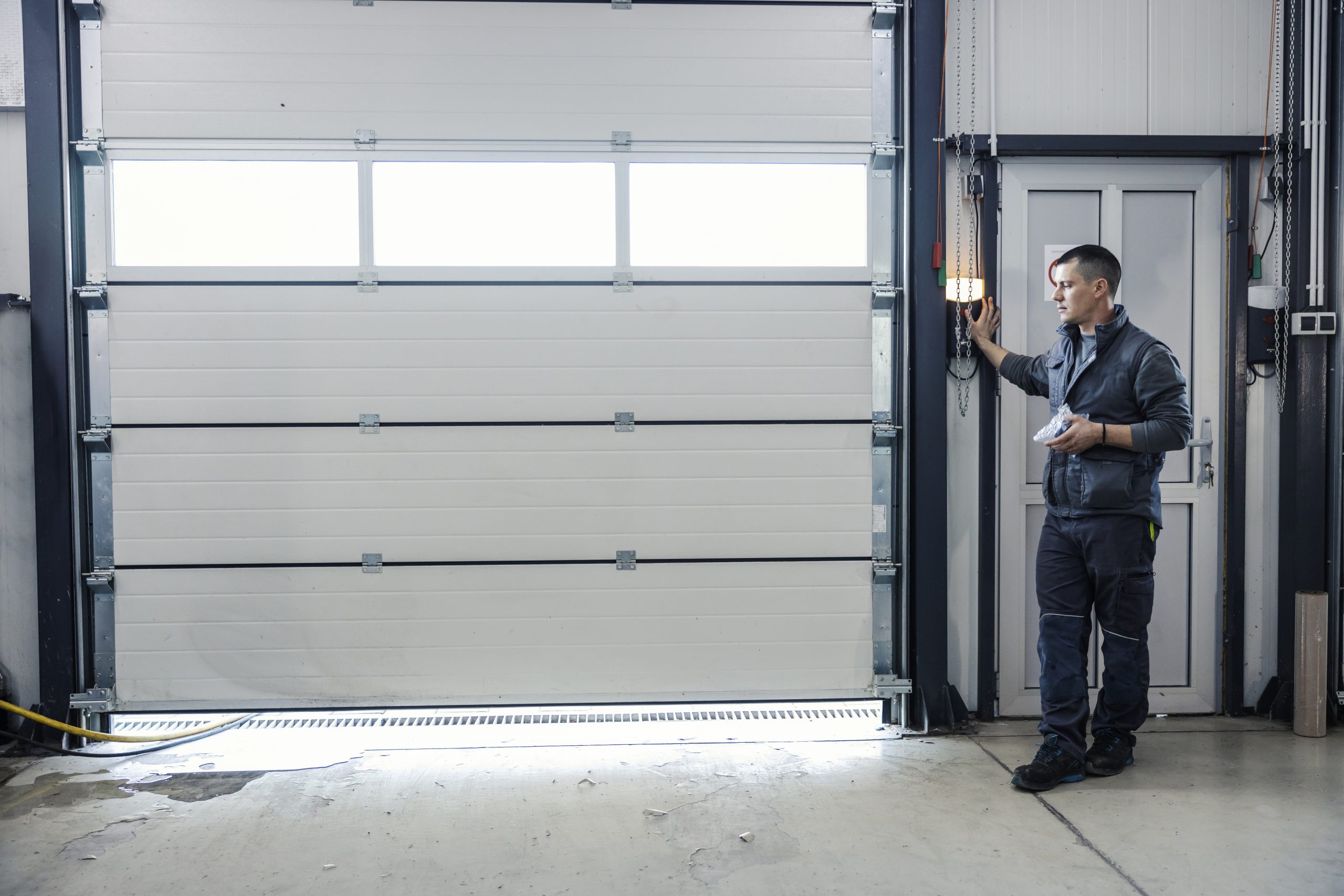 Automechanic Is Opening Garage Door Mechanic39s Workshop Scaled 